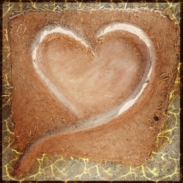 Cob heart in relief with abstract electric flame around the edges.
